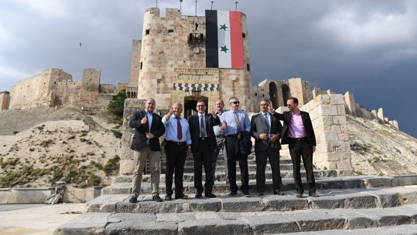 Member of the European Parliament from Germany's National Democratic Party Udo Voigt (2nd-L) visits the Citadel of Aleppo on June 4, 2018 - Sputnik International