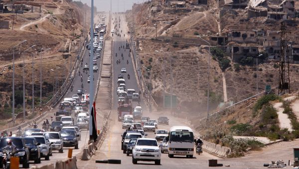 Vehicles travel on the road between Homs and Hama during its re-opening in Rastan, Syria June 6, 2018 Vehicles travel on the road between Homs and Hama during its re-opening in Rastan, Syria June 6, 2018 - Sputnik International