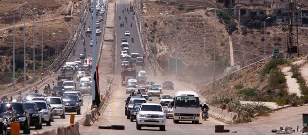 Vehicles travel on the road between Homs and Hama during its re-opening in Rastan, Syria June 6, 2018 - Sputnik International