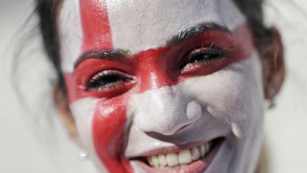 An English soccer fan smiles as she enters the Velodrome stadium ahead of the Euro 2016 Group B soccer match between England and Russia, in Marseille, France, Saturday, June 11, 2016. An English soccer fan smiles as she enters the Velodrome stadium ahead of the Euro 2016 Group B soccer match between England and Russia, in Marseille, France, Saturday, June 11, 2016. - Sputnik International