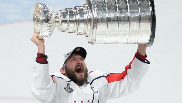 Jun 7, 2018; Las Vegas, NV, USA; Washington Capitals left wing Alex Ovechkin (8) hoists the Stanley Cup after defeating the Vegas Golden Knights in game five of the 2018 Stanley Cup Final at T-Mobile Arena - Sputnik International