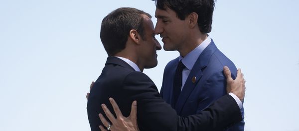 France's President Macron hugs Canada's Prime Minister Trudeau as he arrives at the G7 Summit in Charlevoix - Sputnik International