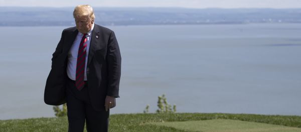 US President Donald Trump steps away after the family photo at the G7 Summit in La Malbaie, Canada, June 8, 2018. - Sputnik International