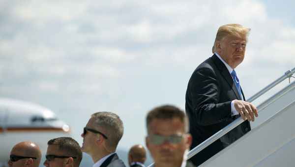 President Donald Trump boards Air Force One for a trip to Singapore to meet with North Korean leader Kim Jong Un, Saturday, June 9, 2018, at Canadian Forces Base Bagotville, in Canada. - Sputnik International