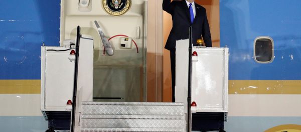 US President Donald Trump waves upon his arrival at Paya Lebar Air Base in Singapore, before his summit with North Korean leader Kim Jong Un, June 10, 2018. US President Donald Trump waves upon his arrival at Paya Lebar Air Base in Singapore, before his summit with North Korean leader Kim Jong Un, June 10, 2018. - Sputnik International