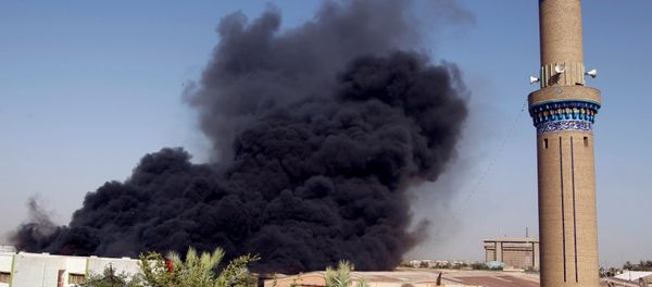 Smoke rises from a storage site in Baghdad, housing ballot boxes from Iraq's May parliamentary election, Iraq June 10, 2018. Smoke rises from a storage site in Baghdad, housing ballot boxes from Iraq's May parliamentary election, Iraq June 10, 2018. - Sputnik International