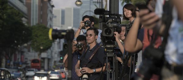 Journalists wait for North Korean leader Kim Jong Un outside the Istana, or Presidential Palace, in Singapore, Sunday, June 10, 2018, Kim met with Singapore Prime Minister Lee Hsien Loong ahead of the summit with U.S. leader Donald Trump - Sputnik International
