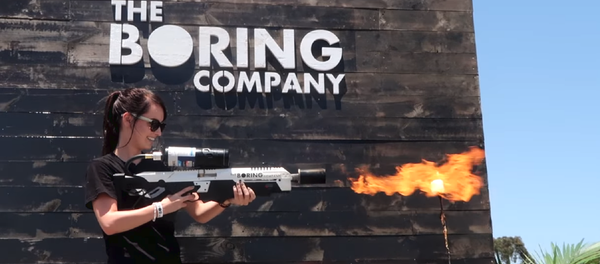 Customer tests out the Not a Flamethrower, manufactured by Elon Musk's Boring Company, in Los Angeles. - Sputnik International