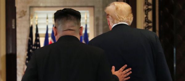 U.S. President Donald Trump and North Korea's leader Kim Jong Un leave after signing documents that acknowledge the progress of the talks and pledge to keep momentum going, after their summit at the Capella Hotel on Sentosa island in Singapore June 12, 2018 U.S. President Donald Trump and North Korea's leader Kim Jong Un leave after signing documents that acknowledge the progress of the talks and pledge to keep momentum going, after their summit at the Capella Hotel on Sentosa island in Singapore June 12, 2018 - Sputnik International