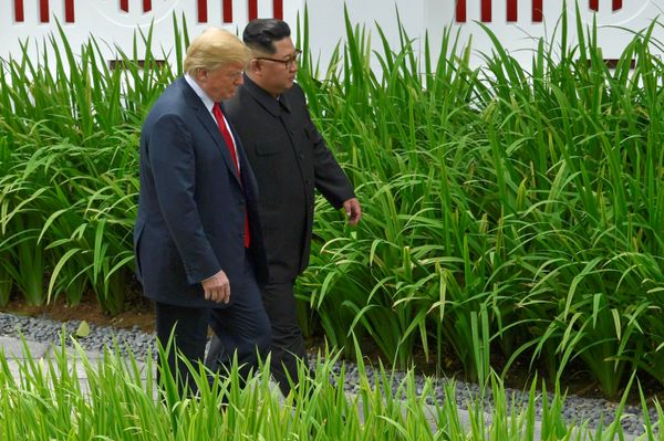 U.S. President Donald Trump and North Korean leader Kim Jong Un walk in the Capella Hotel after their working lunch, on Sentosa island in Singapore June 12, 2018 - Sputnik International
