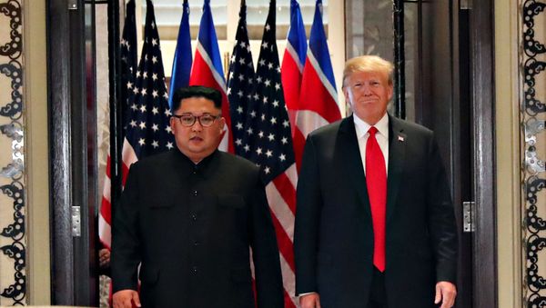 U.S. President Donald Trump and North Korea's leader Kim Jong Un arrive to sign documents that acknowledge the progress of the talks and pledge to keep momentum going, after their summit at the Capella Hotel on Sentosa island in Singapore June 12, 2018 U.S. President Donald Trump and North Korea's leader Kim Jong Un arrive to sign documents that acknowledge the progress of the talks and pledge to keep momentum going, after their summit at the Capella Hotel on Sentosa island in Singapore June 12, 2018 - Sputnik International