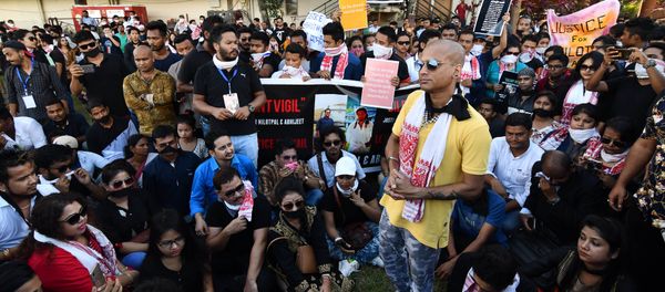 Indian people stage a silent protest demanding to arrest and punish the culprits involved in the killing of two youth in Karbi Anglong district of Assam, in Guwahati on June 11, 2018 Indian people stage a silent protest demanding to arrest and punish the culprits involved in the killing of two youth in Karbi Anglong district of Assam, in Guwahati on June 11, 2018 - Sputnik International