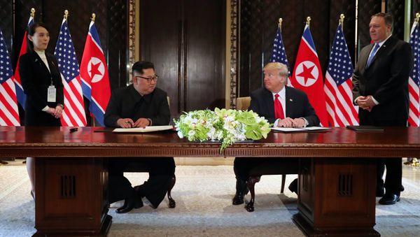 U.S. President Donald Trump and North Korea's leader Kim Jong Un look at each others before signing documents that acknowledge the progress of the talks and pledge to keep momentum going, after their summit at the Capella Hotel on Sentosa island in Singapore June 12, 2018 U.S. President Donald Trump and North Korea's leader Kim Jong Un look at each others before signing documents that acknowledge the progress of the talks and pledge to keep momentum going, after their summit at the Capella Hotel on Sentosa island in Singapore June 12, 2018 - Sputnik International