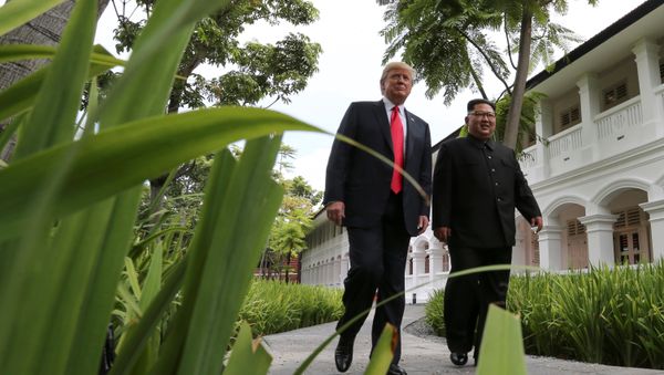 U.S. President Donald Trump and North Korea's leader Kim Jong Un walk together before their working lunch during their summit at the Capella Hotel on the resort island of Sentosa, Singapore June 12, 2018 U.S. President Donald Trump and North Korea's leader Kim Jong Un walk together before their working lunch during their summit at the Capella Hotel on the resort island of Sentosa, Singapore June 12, 2018 - Sputnik International