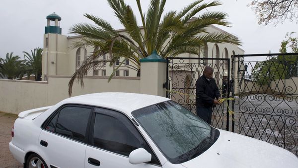 An investigator attends to the gates of a mosque in Malmesbury, near Cape Town, South Africa Thursday June 14 2018 An investigator attends to the gates of a mosque in Malmesbury, near Cape Town, South Africa Thursday June 14 2018 - Sputnik International
