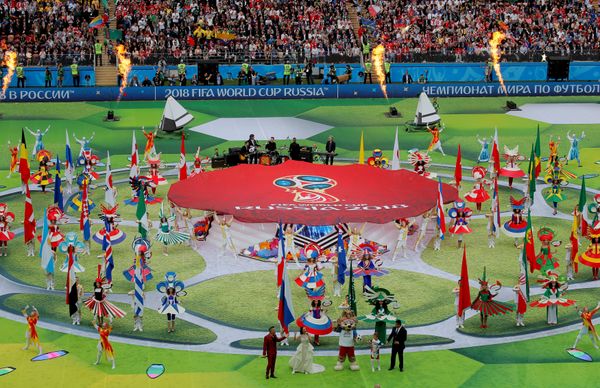 Soccer Football - World Cup - Opening Ceremony - Luzhniki Stadium, Moscow, Russia - June 14, 2018 Robbie Williams, Aida Garifullina, former player Ronaldo and World Cup mascot Zabivaka during the opening ceremony - Sputnik International