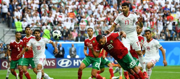 Soccer Football - World Cup - Group B - Morocco vs Iran - Saint Petersburg Stadium, Saint Petersburg, Russia - June 15, 2018 Morocco's Aziz Bouhaddouz scores an own goal for Iran's first goal - Sputnik International