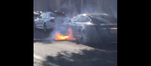 Burning Tesla car Burning Tesla car - Sputnik International