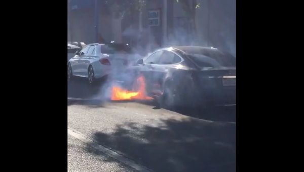 Burning Tesla car Burning Tesla car - Sputnik International