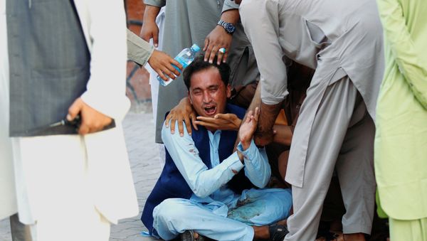 An Afghan man mourns in a hospital after a car bomb, Jalalabad city, Afghanistan June 16, 2018 An Afghan man mourns in a hospital after a car bomb, Jalalabad city, Afghanistan June 16, 2018 - Sputnik International
