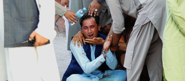 An Afghan man mourns in a hospital after a car bomb, Jalalabad city, Afghanistan June 16, 2018 An Afghan man mourns in a hospital after a car bomb, Jalalabad city, Afghanistan June 16, 2018 - Sputnik International