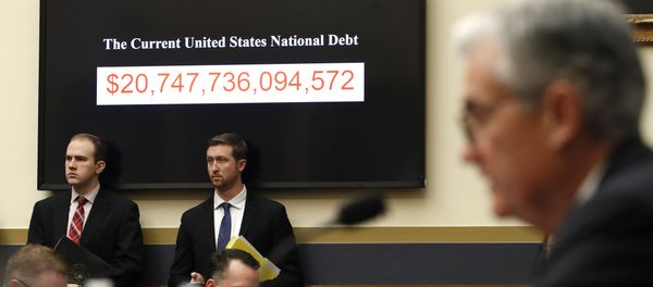 The National debt is shown behind Federal Reserve Chairman Jerome Powell as he testifies on the semiannual monetary policy report to the House Financial Services Committee, Tuesday, Feb. 27, 2018, in Washington The National debt is shown behind Federal Reserve Chairman Jerome Powell as he testifies on the semiannual monetary policy report to the House Financial Services Committee, Tuesday, Feb. 27, 2018, in Washington - Sputnik International