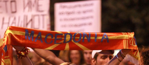 Protestors shout slogans against the change of the country's constitutional name in front of the Parliament building in Skopje, Macedonia June 13, 2018. - Sputnik International