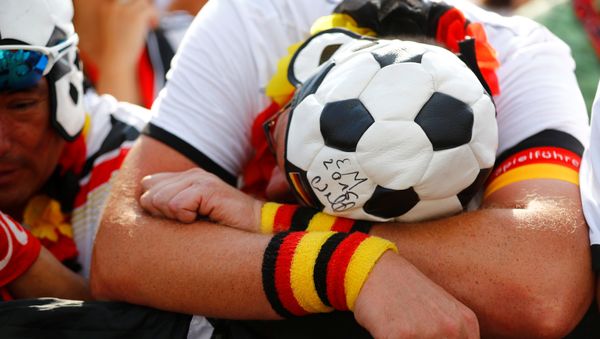 Soccer Football - World Cup - Group F - Germany vs Mexico - Berlin - Germany - June 17, 2018 - Germany fans during the match at Brandenburg Gate - Sputnik International