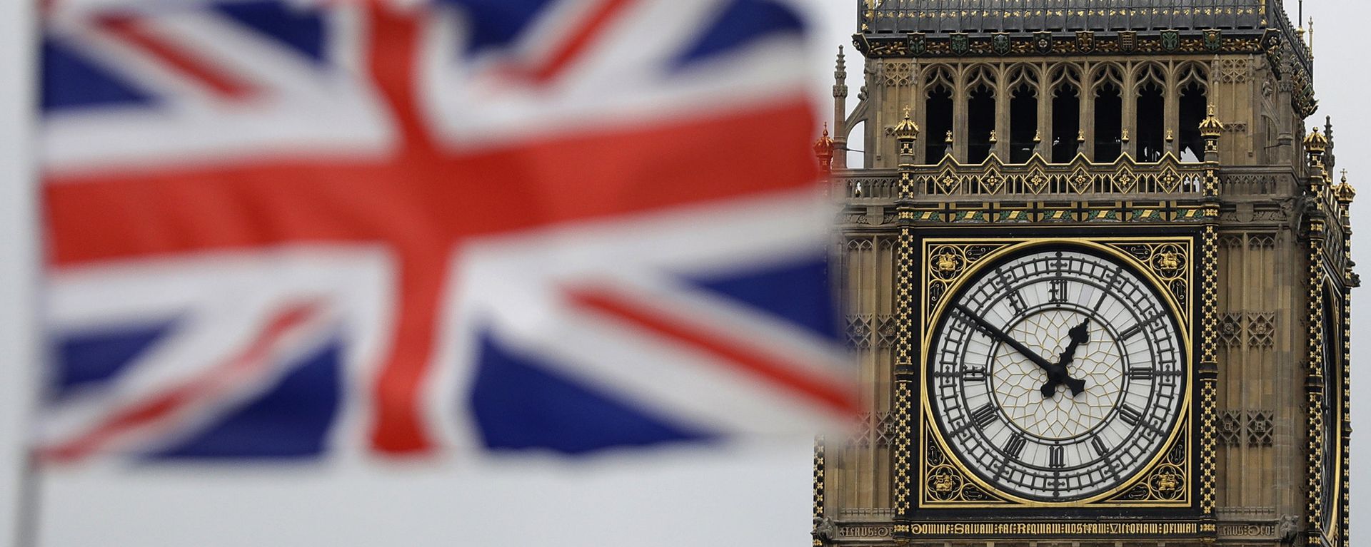 a British flag is blown by the wind near to Big Ben's clock tower in front of the UK Houses of Parliament in central London a British flag is blown by the wind near to Big Ben's clock tower in front of the UK Houses of Parliament in central London - Sputnik International, 1920, 19.08.2023