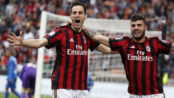 AC Milan's Nikola Kalinic, left, celebrates with his teammate Patrick Cutrone after scoring his side's third goal during the Serie A soccer match between AC Milan and Fiorentina at the San Siro stadium in Milan, Italy, Sunday, May 20, 2018 - Sputnik International