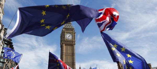 EU and Union flags fly above Parliament Square during a Unite for Europe march, in central London, Britain - Sputnik International