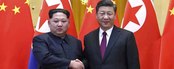 In this photo provided Wednesday, March 28, 2018, by China's Xinhua News Agency, North Korean leader Kim Jong Un, left, and Chinese President Xi Jinping shake hands in Beijing, China. In this photo provided Wednesday, March 28, 2018, by China's Xinhua News Agency, North Korean leader Kim Jong Un, left, and Chinese President Xi Jinping shake hands in Beijing, China. - Sputnik International