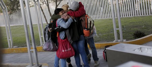 Cuban migrants embrace after traveling en route from Costa Rica to El Salvador, Guatemala and Mexico, before continuing their journey to U.S., on the border between the U.S. and Mexico in Reynosa, in Tamaulipas state, Mexico Cuban migrants embrace after traveling en route from Costa Rica to El Salvador, Guatemala and Mexico, before continuing their journey to U.S., on the border between the U.S. and Mexico in Reynosa, in Tamaulipas state, Mexico - Sputnik International