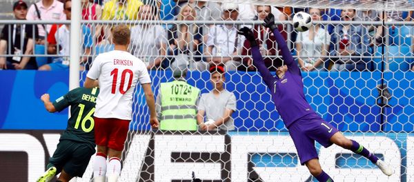 Soccer Football - World Cup - Group C - Denmark vs Australia - Samara Arena, Samara, Russia - June 21, 2018 Denmark's Christian Eriksen scores their first goal past Australia's Mathew Ryan Soccer Football - World Cup - Group C - Denmark vs Australia - Samara Arena, Samara, Russia - June 21, 2018 Denmark's Christian Eriksen scores their first goal past Australia's Mathew Ryan - Sputnik International