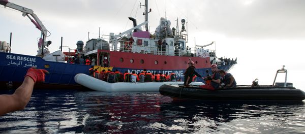 Migrants are seen in a rubber dinghy as they are rescued by the crew of the Mission Lifeline rescue boat in the central Mediterranean Sea, June 21, 2018 Migrants are seen in a rubber dinghy as they are rescued by the crew of the Mission Lifeline rescue boat in the central Mediterranean Sea, June 21, 2018 - Sputnik International