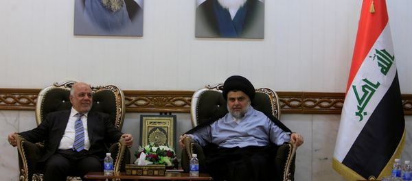 Iraqi Prime Minister Haider al-Abadi, who's political bloc came third in a May parliamentary election, meets with cleric Moqtada al-Sadr, who's bloc came first, in Najaf Iraqi Prime Minister Haider al-Abadi, who's political bloc came third in a May parliamentary election, meets with cleric Moqtada al-Sadr, who's bloc came first, in Najaf - Sputnik International