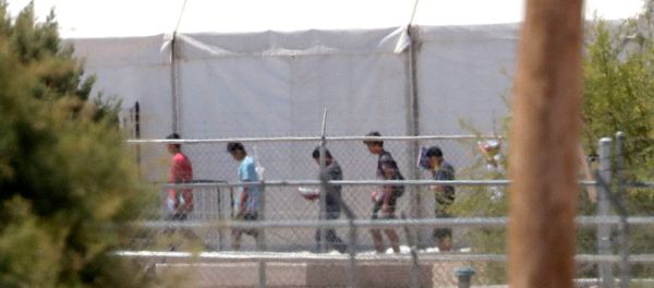 Detainees are seen outside tent shelters used to hold separated family members, Friday, June 22, in Fabens, Texas. The U.N human rights office says President Donald Trump's decision to stop the U.S. policy separating migrant parents from their children doesn't go far enough - Sputnik International