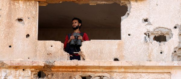 A fighter from the Free Syrian Army is seen in Yadouda area in Deraa, Syria May 29, 2018 - Sputnik International