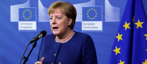 Germany's Chancellor Angela Merkel addresses media representatives as she arrives ahead of a summit at EU headquarters in Brussels on June 24, 2018 - Sputnik International