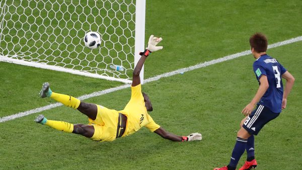 Soccer Football - World Cup - Group H - Japan vs Senegal - Ekaterinburg Arena, Yekaterinburg, Russia - June 24, 2018 Senegal's Khadim N'Diaye is beaten as Japan's Takashi Inui (not pictured) scores their first goal - Sputnik International