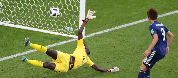 Soccer Football - World Cup - Group H - Japan vs Senegal - Ekaterinburg Arena, Yekaterinburg, Russia - June 24, 2018 Senegal's Khadim N'Diaye is beaten as Japan's Takashi Inui (not pictured) scores their first goal Soccer Football - World Cup - Group H - Japan vs Senegal - Ekaterinburg Arena, Yekaterinburg, Russia - June 24, 2018 Senegal's Khadim N'Diaye is beaten as Japan's Takashi Inui (not pictured) scores their first goal - Sputnik International