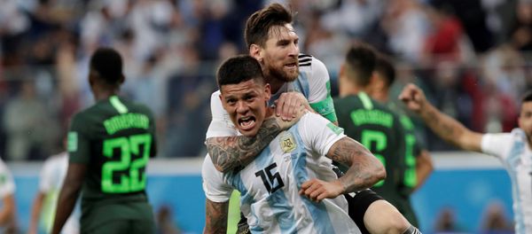 Soccer Football - World Cup - Group D - Nigeria vs Argentina - Saint Petersburg Stadium, Saint Petersburg, Russia - June 26, 2018 Argentina's Marcos Rojo celebrates scoring their second goal with Lionel Messi - Sputnik International
