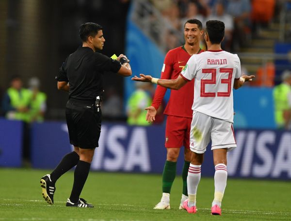 Referee Enrique Caceres shows a yellow card to Portugal's Cristiano Ronaldo during the World Cup Group B soccer match between Iran and Portugal at the Mordovia Arena, in Saransk, Russia, June 25, 2018. - Sputnik International