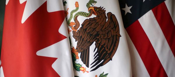 FILE PHOTO: Flags are pictured during NAFTA talks involving the United States, Mexico and Canada, in Mexico City, Mexico, November 19, 2017 FILE PHOTO: Flags are pictured during NAFTA talks involving the United States, Mexico and Canada, in Mexico City, Mexico, November 19, 2017 - Sputnik International