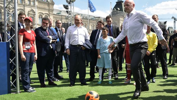 June 28, 2018. Russian President Vladimir Putin and FIFA president Gianni Infantino, right, visit the themed 2018 FIFA World Cup Football Park on Red Square June 28, 2018. Russian President Vladimir Putin and FIFA president Gianni Infantino, right, visit the themed 2018 FIFA World Cup Football Park on Red Square - Sputnik International