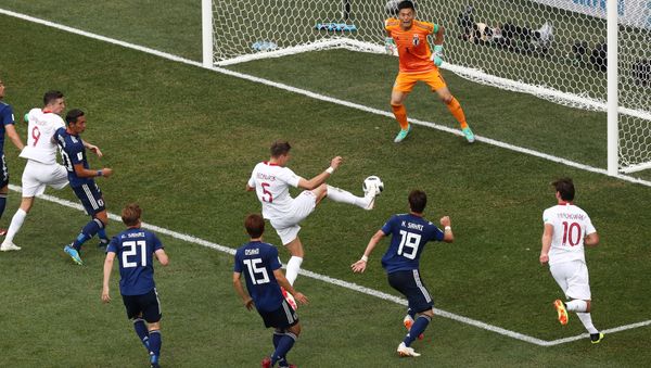 Soccer Football - World Cup - Group H - Japan vs Poland - Volgograd Arena, Volgograd, Russia - June 28, 2018 Poland's Jan Bednarek scores their first goal - Sputnik International