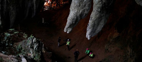 Rescue workers are seen in Tham Luang caves during a search for 12 members of an under-16 soccer team and their coach, in the northern province of Chiang Rai, Thailand, June 27, 2018. - Sputnik International