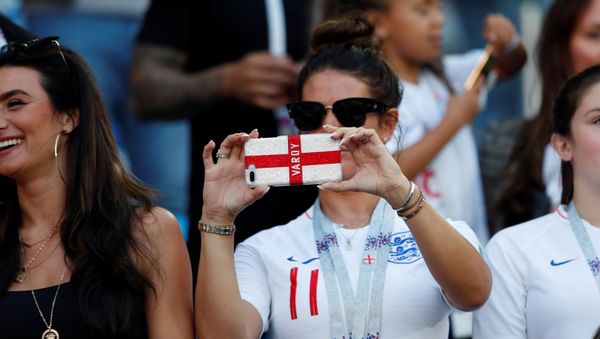 World Cup - Group G - England vs Belgium - Kaliningrad Stadium, Kaliningrad, Russia - June 28, 2018 Rebekah Vardy, wife of England's Jamie Vardy, takes a photo in the stands - Sputnik International