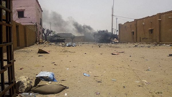 Smoke billows from an army armoured vehicle in Gao after and explosion on July 1, 2018 Smoke billows from an army armoured vehicle in Gao after and explosion on July 1, 2018 - Sputnik International