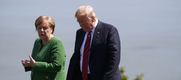 President Donald Trump, right, talks with German Chancellor Angela Merkel after the family photo during the G7 Summit, Friday, June 8, 2018, in Charlevoix, Canada President Donald Trump, right, talks with German Chancellor Angela Merkel after the family photo during the G7 Summit, Friday, June 8, 2018, in Charlevoix, Canada - Sputnik International